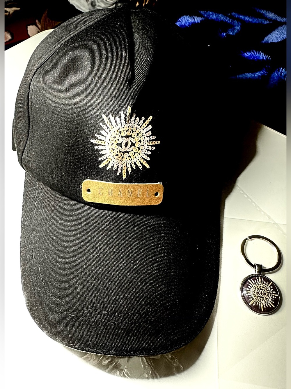 CHANEL Novelty Gift Set: Black Baseball Cap Gold Sunburst Emblem w/ Key Ring